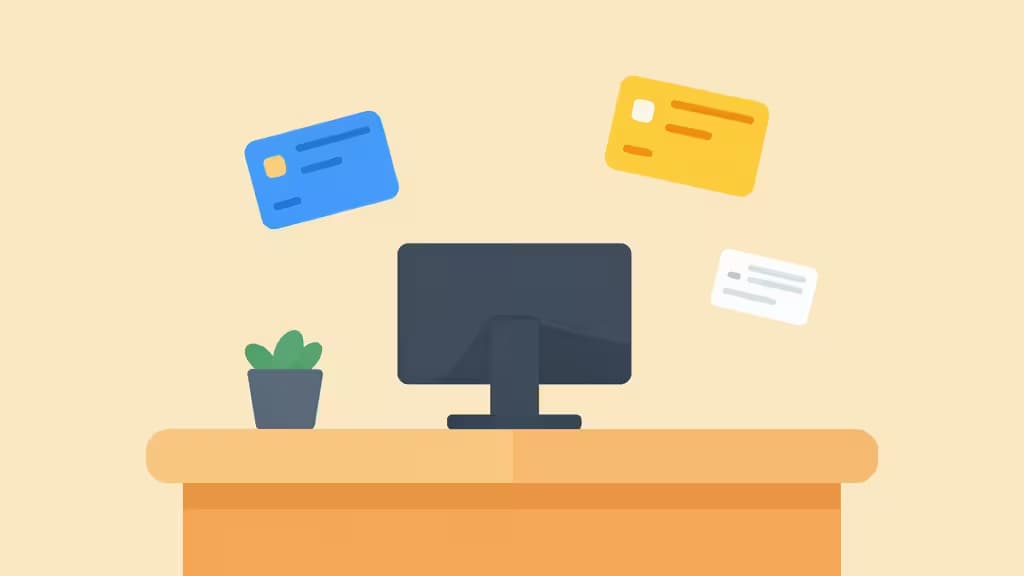 Flat illustration shows a desk with a monitor, potted plant, and floating blue, yellow, and white payment cards.