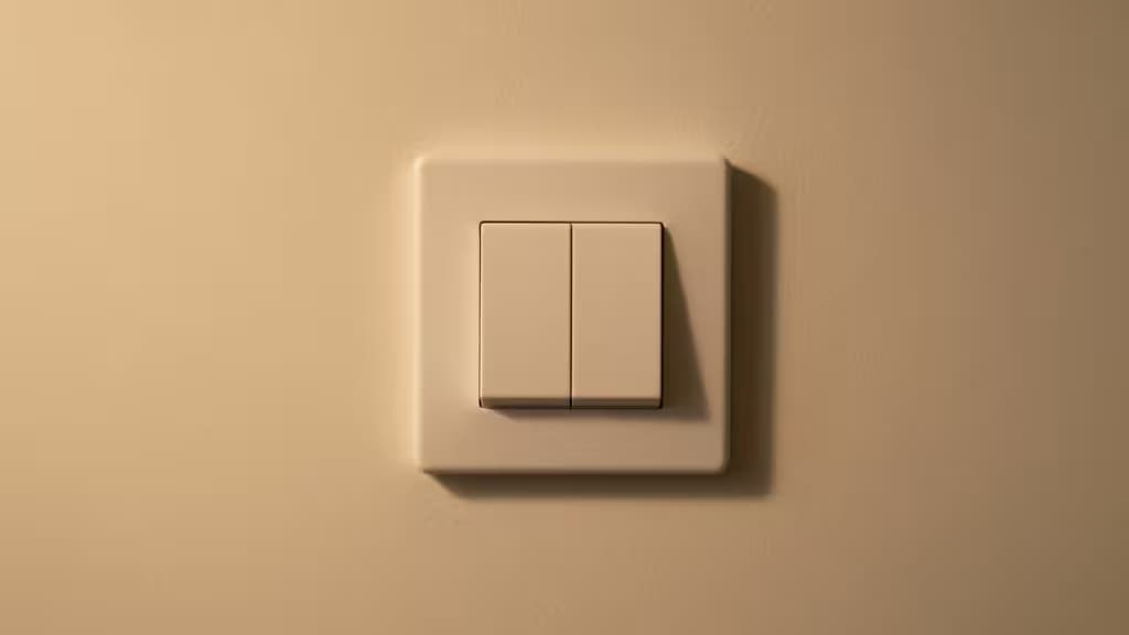 A modern smart light switch mounted on a wall in an older home, warm ambient lighting highlighting the clean minimalist design.