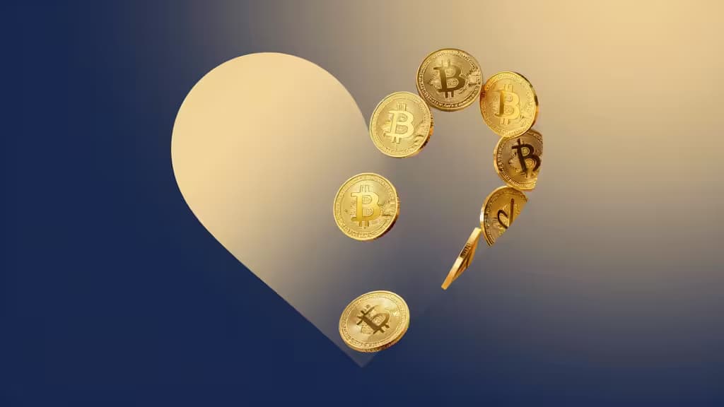 Golden Bitcoin coins float around a glowing heart against a blue gradient background, symbolizing crypto donations for nonprofits.