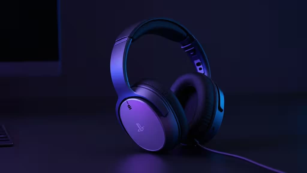 PlayStation 5 headset rests on dark surface, illuminated by purple ambient light.