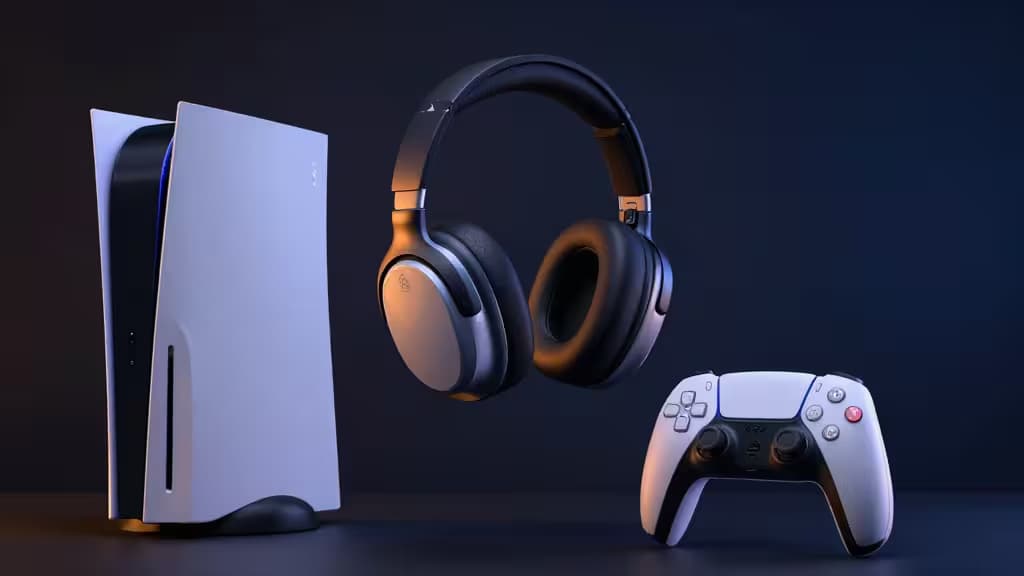 Black wireless gaming headset floats between a white PS5 console and DualSense controller on a dark surface.