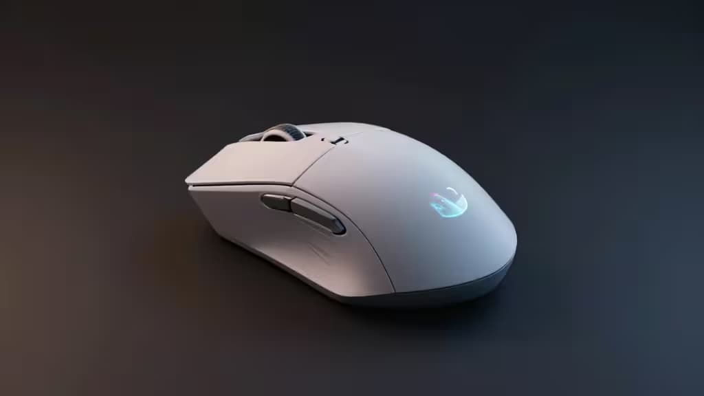 Sleek white gaming mouse with glowing RGB logo rests on dark surface, highlighting its minimalist design and modern aesthetic.